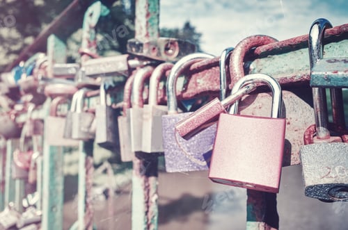 Preview: Old rusty love padlocks on a bridge.