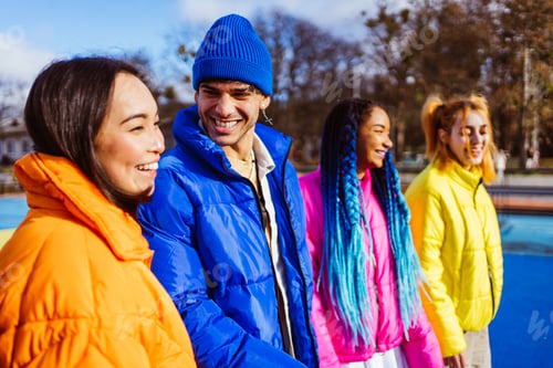 Preview: Multiracial group of young friends meeting outdoors in winter
