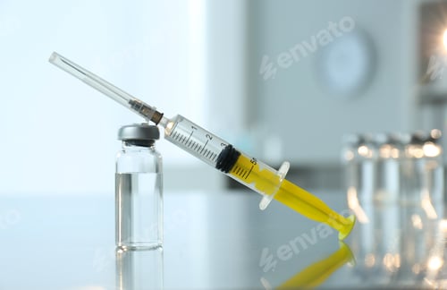 Preview: Syringe with vial of medicine on table