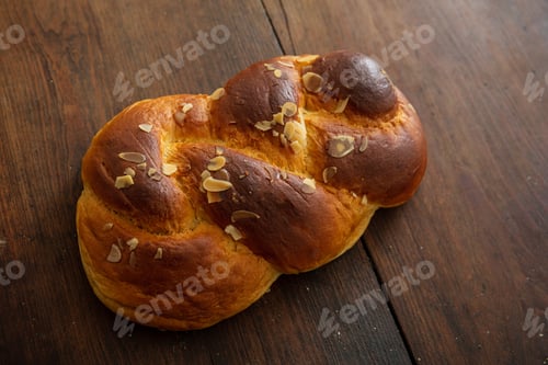 Preview: Sweet bread, easter greek tsoureki braid on wood background
