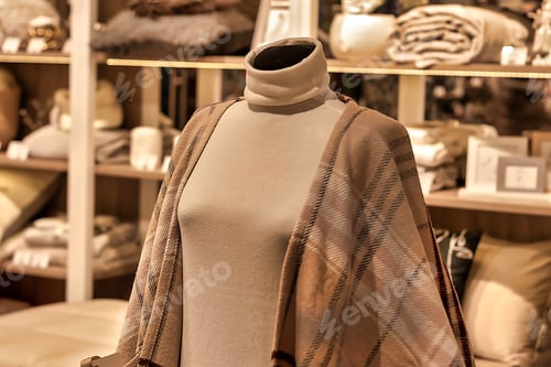 Preview: Clothes on a mannequin. Front view from the side. Pastel tones.