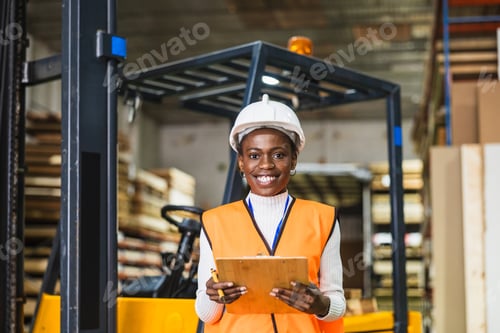 Preview: Female worker smiling in front of forklift