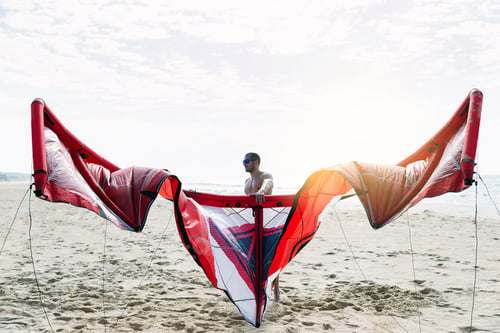Preview: Portrait of handsome man kitesurfer.