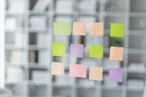 Preview: Business planning concept and sticky note on glass wall for information reminder.