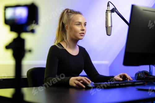 Preview: Professional e-sport gamer girl streaming and plays online video game on PC