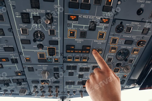Preview: Pilot toggling switch for windshield heating in cockpit