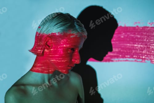 Preview: beauty portrait of androgynous woman with abstract projection screen on her face