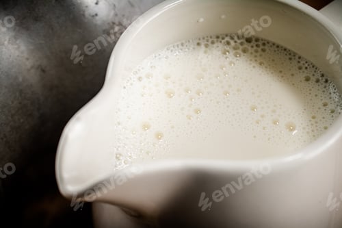 Preview: Jug of milk. Macro background.