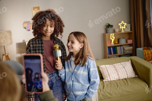 Preview: Two Generation Alpha Girls Singing Karaoke and Recording Video with Smartphone