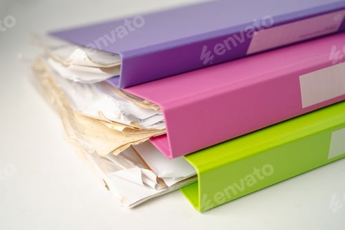 Preview: File Folder Binder stack of multi color on table in office.