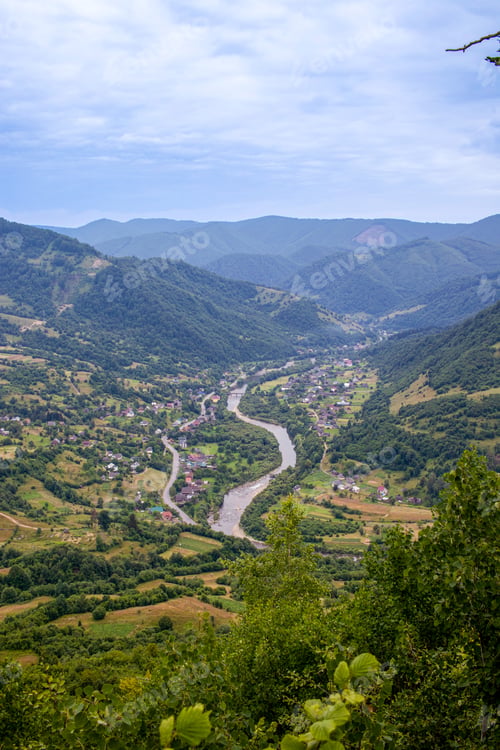 Preview: Carpathian Mountains Range, Ukraine. Carpathian view of a mountain river and village