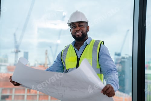 Preview: Portrait of Construction engineer working on building site in the office.