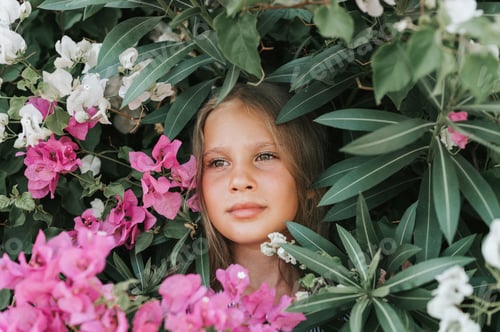 Preview: face candid little kid girl enjoy green plants pink blossom flowers summer time vacation travel
