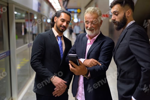 Preview: Three multi ethnic bearded businessmen together around the city
