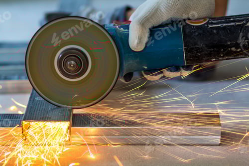 Preview: Close-up of worker cutting metal with grinder. Sparks while grinding iron.
