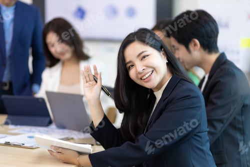 Preview: Portrait of a attractive business woman in a business office meeting room.