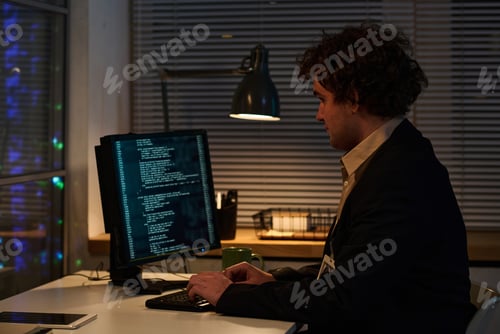 Preview: Programmer working with codes on computer