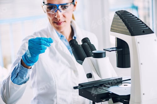 Preview: Scientist researching in laboratory