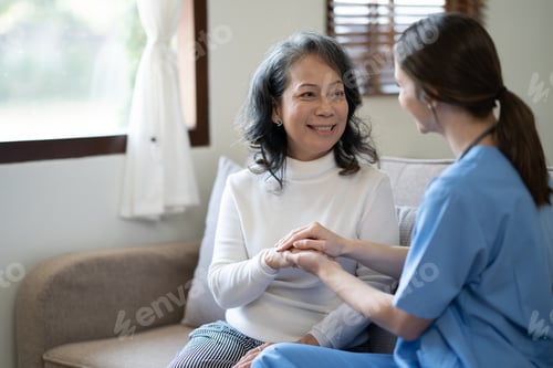 Preview: Female doctor holding female patient hands with compassion and comfort for encouragement and empathy