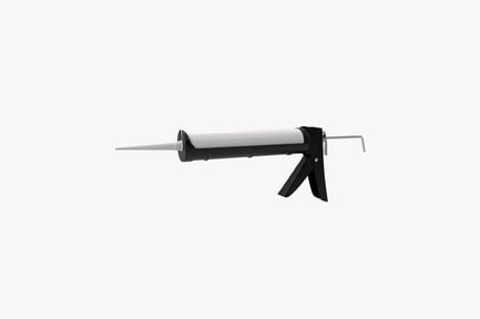 Caulk gun with nozzle and clamp