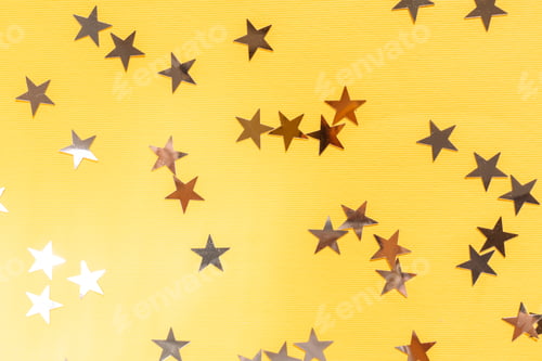 Preview: Star shaped glitter on yellow background