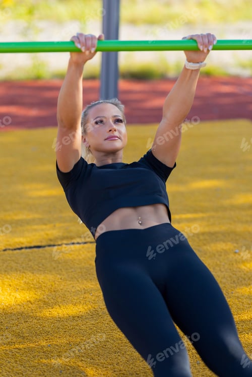 Preview: Woman Performing Outdoor Calisthenics Exercise at a Fitness Park