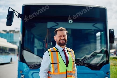 Preview: Portrait of happy bus driver looking at camera.