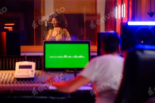 Preview: Latino woman singing in a soundproof booth in a music studio