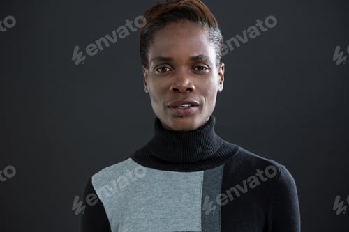 Preview: Androgynous man against grey background