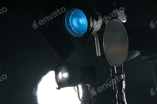 Preview: Studio Lighting Setup for a Creative Photo Shoot With Various Light Sources in a Dark Environment
