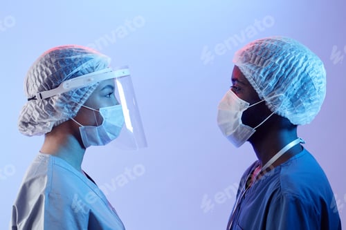 Preview: Profile View of Two Doctors Looking at Each Other