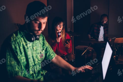 Preview: young woman singer reading lyrics on smartphone