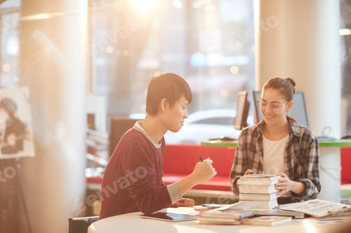 Preview: Students reading books in the library