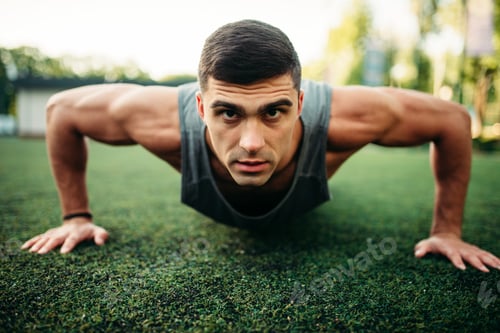 Preview: Male athlete doing push-up exercise outdoor