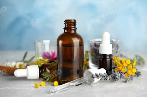 Preview: Composition with essential oils and flowers on table