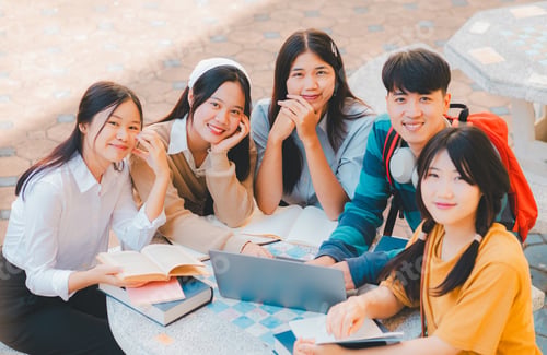 Preview: group of students young university students consulting doing homework