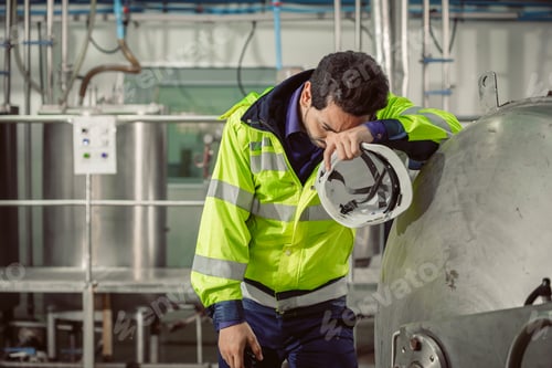 Preview: tired fatigue exhaustion engineer worker hard working in factory. worker sick from Corona virus flu.