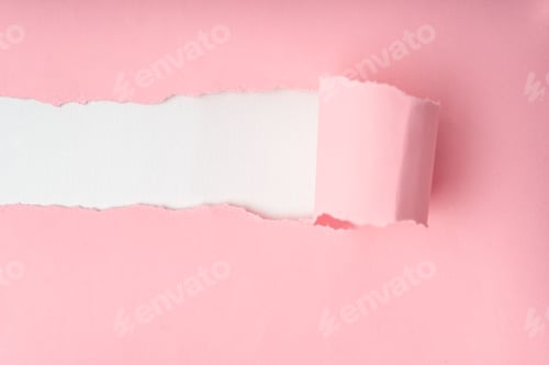 Preview: Torn pink paper revealing white background. Texture, background.