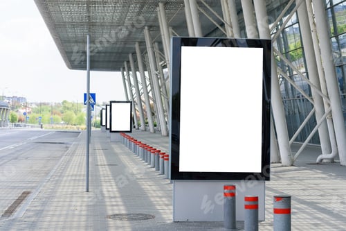Preview: Outdoor advertising poster on the background of the columns of a modern building.