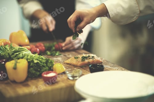 Preview: Chef hands preparing marinated Salmon fish