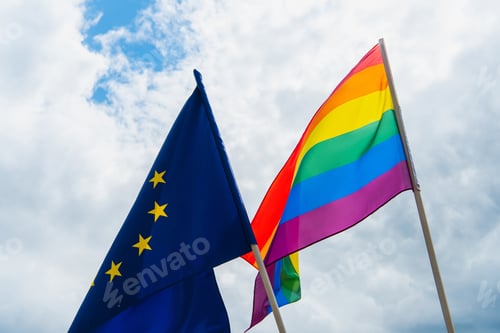 Preview: American and lgbt flags against sky with clouds