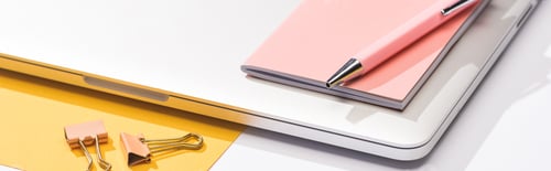 Preview: panoramic shot of laptop, paper, notebook, pen and paper clips