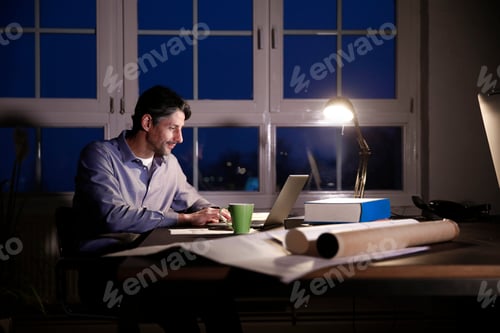 Preview: Man working late in office