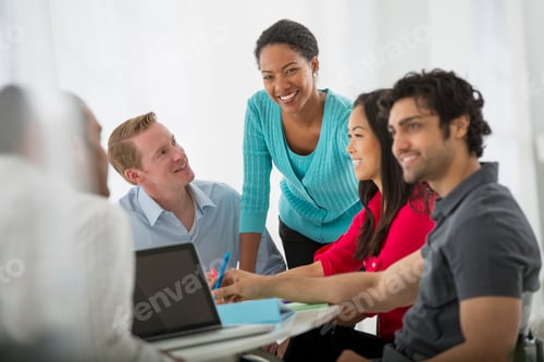 Preview: An office in the city. A multi ethnic group of people around a table, Teamwork. Meeting.