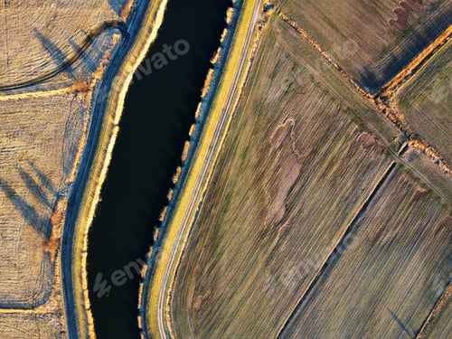 Vista previa: Drone shot of a river in a field