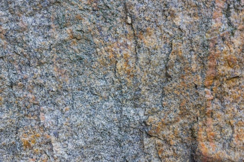 Preview: Granite Texture Close Up. Granite Rocks With Porous Surface. Background From Solid Stone. Pattern