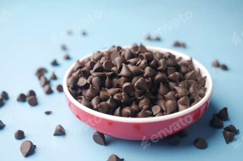 Preview: Chocolate chips spilling from a plastic packet,