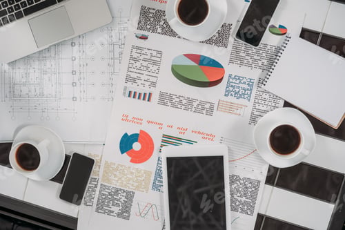 Preview: top view of business documents on workplace with digital devices and coffee
