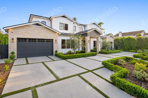 Preview: the front of this home is well maintained and has a garage with doors