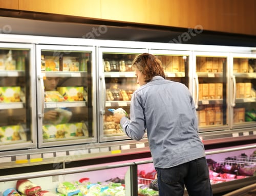 Preview: Man Choosing Frozen Food From A Supermarket Freezer